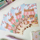 postal kawaii con diseño de cafetería y libros en un día de primavera, ilustración original de papelería bonita