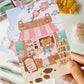 postal kawaii con diseño de cafetería y libros en un día de primavera, ilustración original de papelería bonita