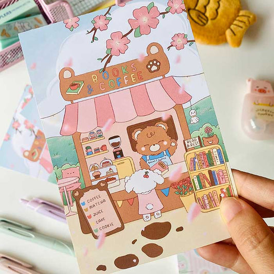 postal kawaii con diseño de cafetería y libros en un día de primavera, ilustración original de papelería bonita