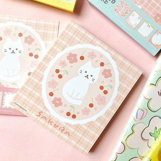 bloc de notas de papelería japonesa con diferentes diseños de perros y gato en primavera, con flores de sakura, mimosa y dulces
